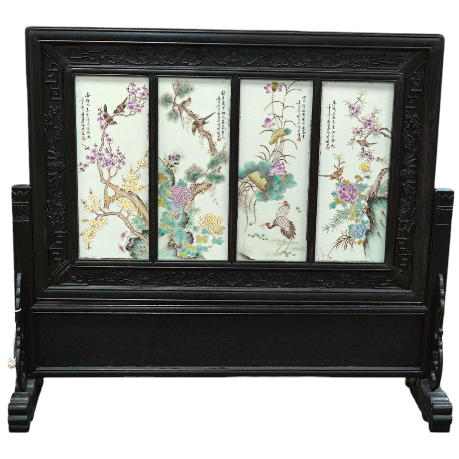 A Chinese hardwood screen with four porcelain panels. Condition - fair to good